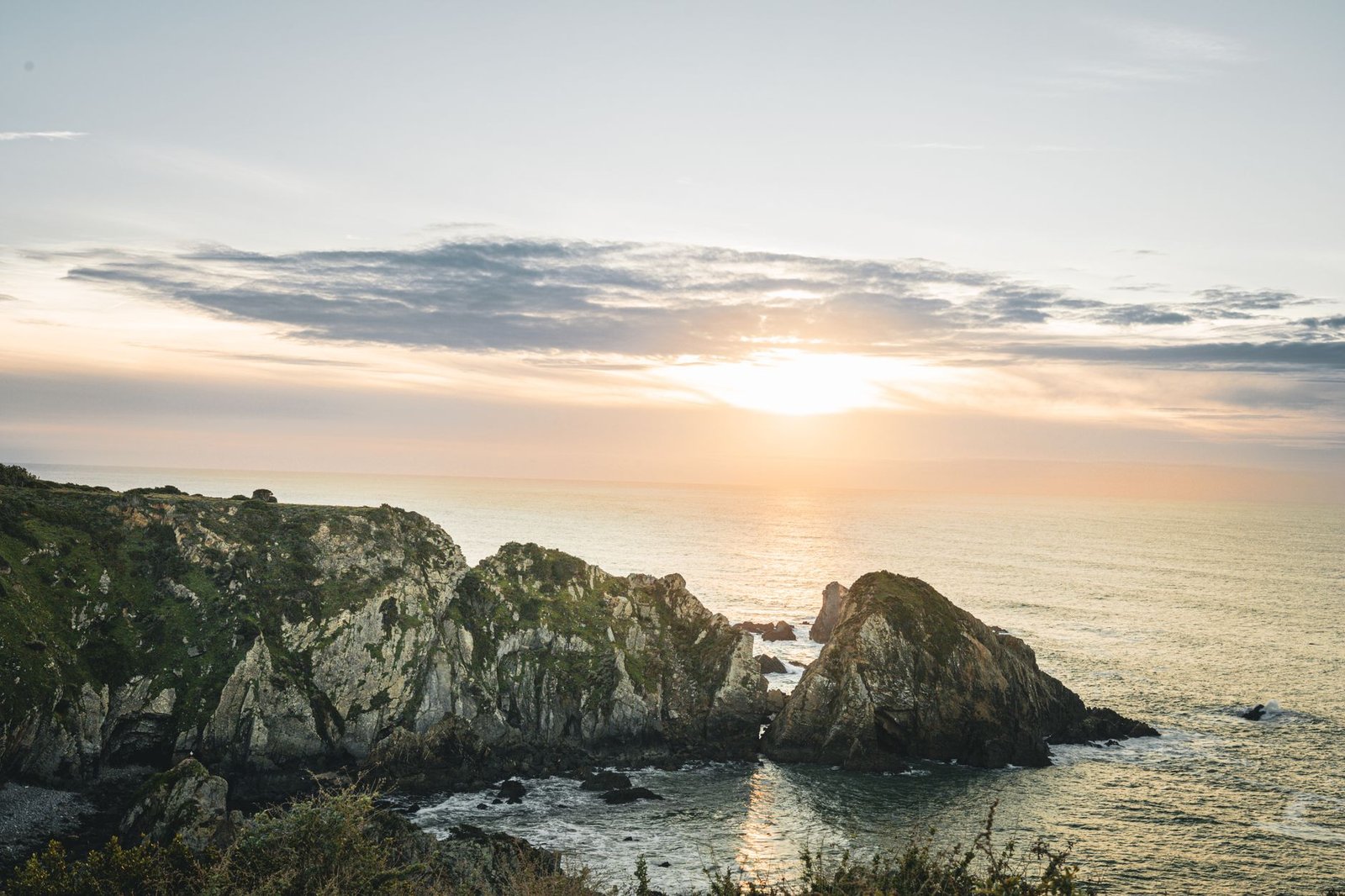view of the Azenhas cliffs at sunset in Lisboa, Portugal, overlooking the Atlantic Ocean