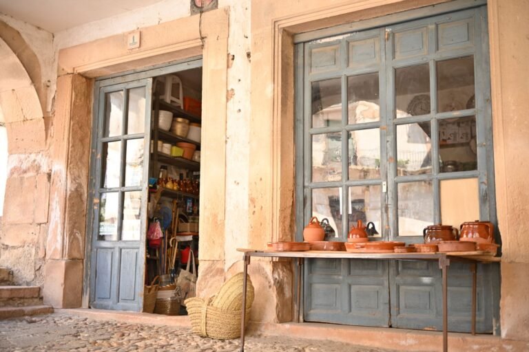 rustic Spanish doorway with traditional pottery on display, Sepúlveda, Spain