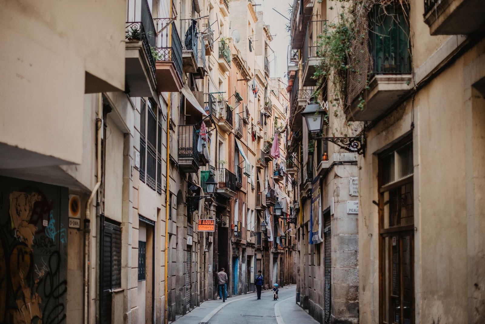 Explore the narrow, historic street in Barcelona's Gothic Quarter with architecture