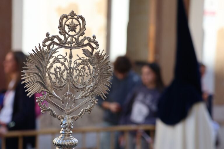 Close-up of an ornate religious symbol during Semana Santa procession in El Puerto de Santa María, Spain