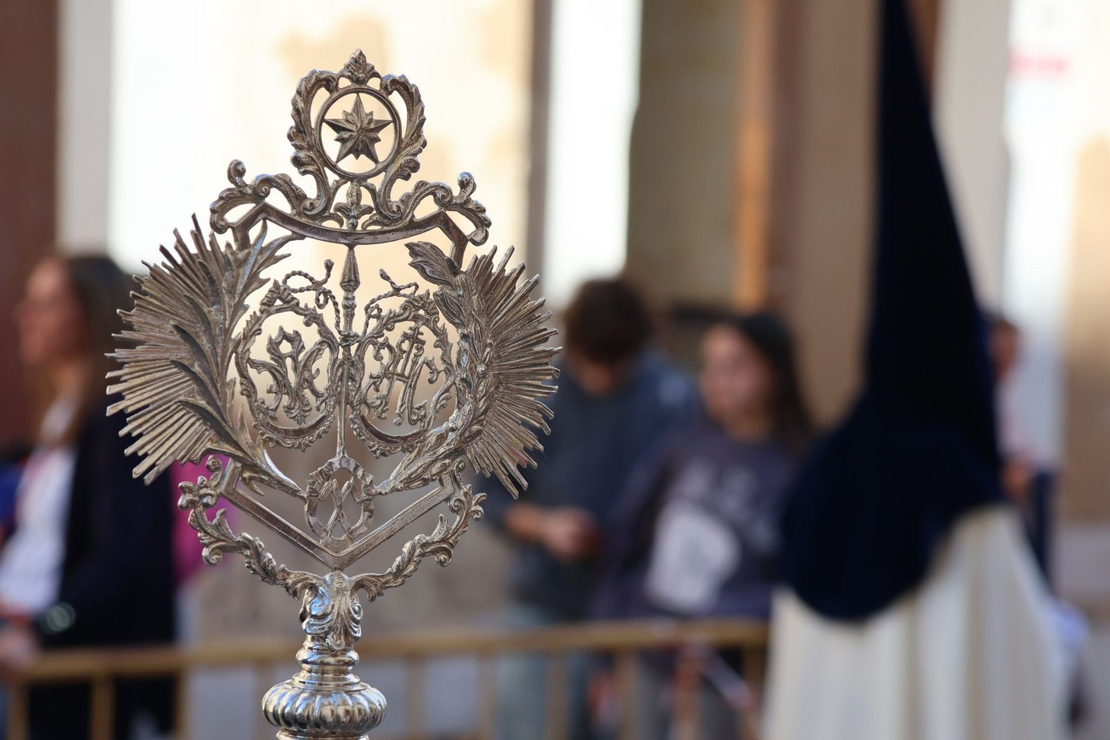 Close-up of an ornate religious symbol during Semana Santa procession in El Puerto de Santa María, Spain