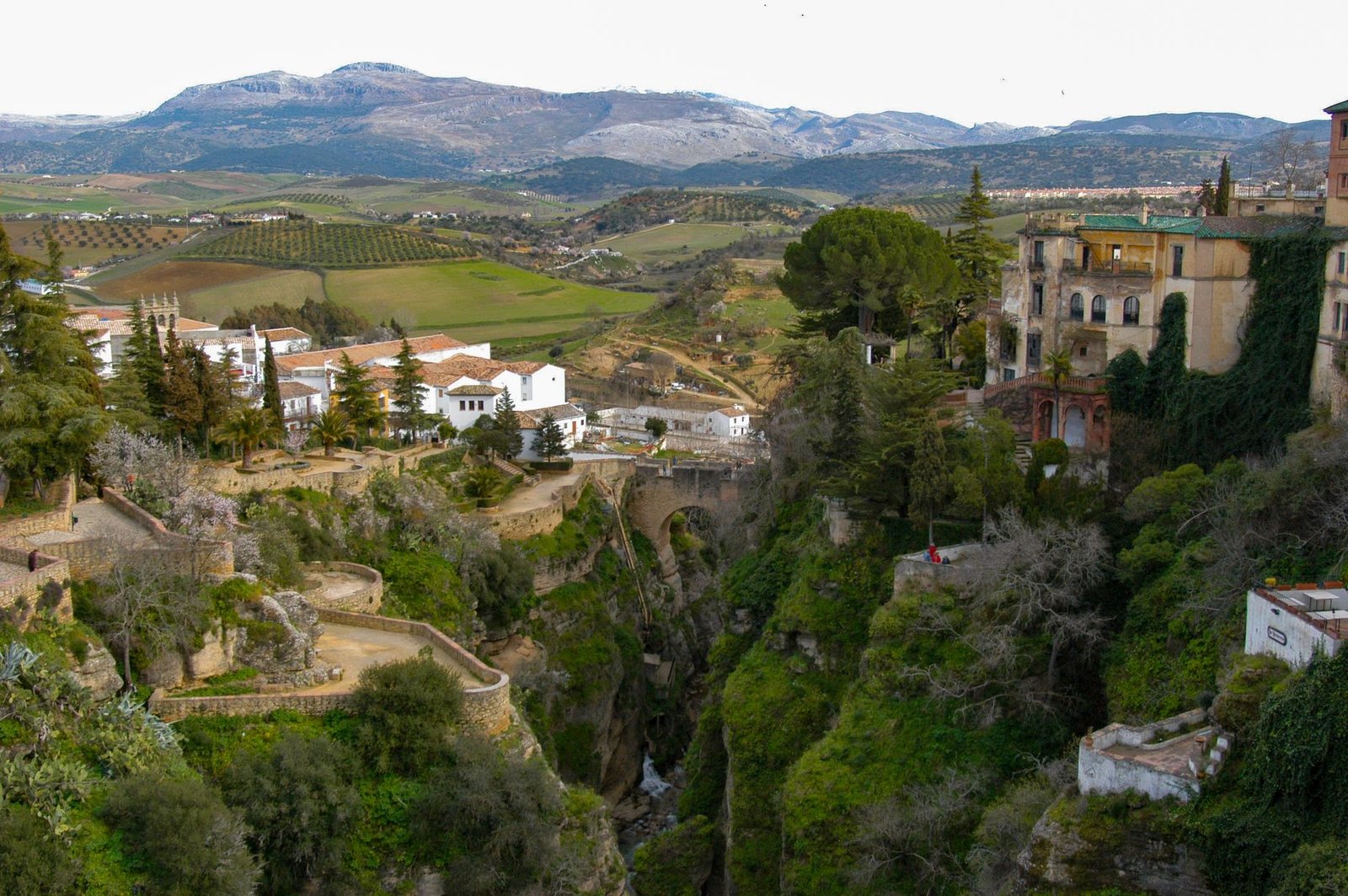 A view of Ronda, Spain, showcasing its historic architecture and green landscape