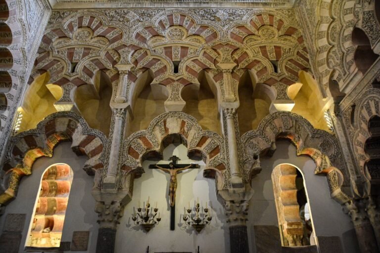 Detailed view of the Moorish arches inside the Mezquita-Catedral de Córdoba, showcasing Islamic art