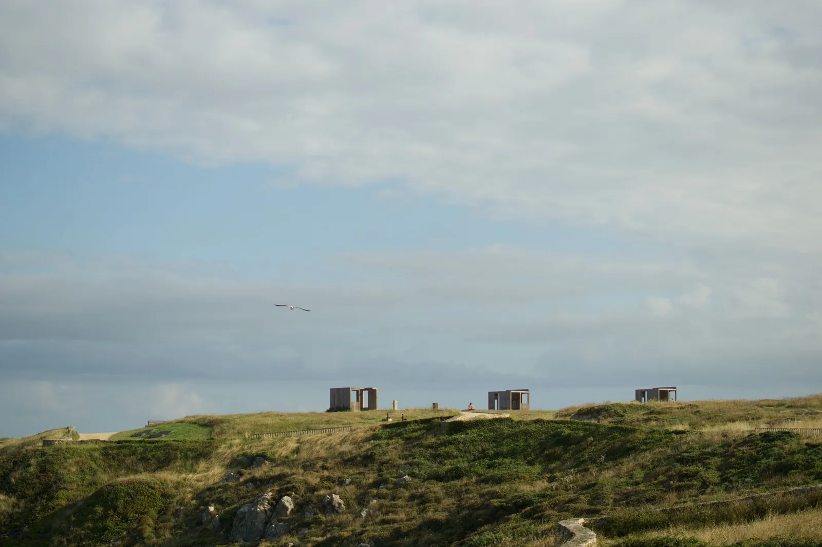 Scenic rural landscape in La Coruña, Spain featuring hills and cloudy sky
