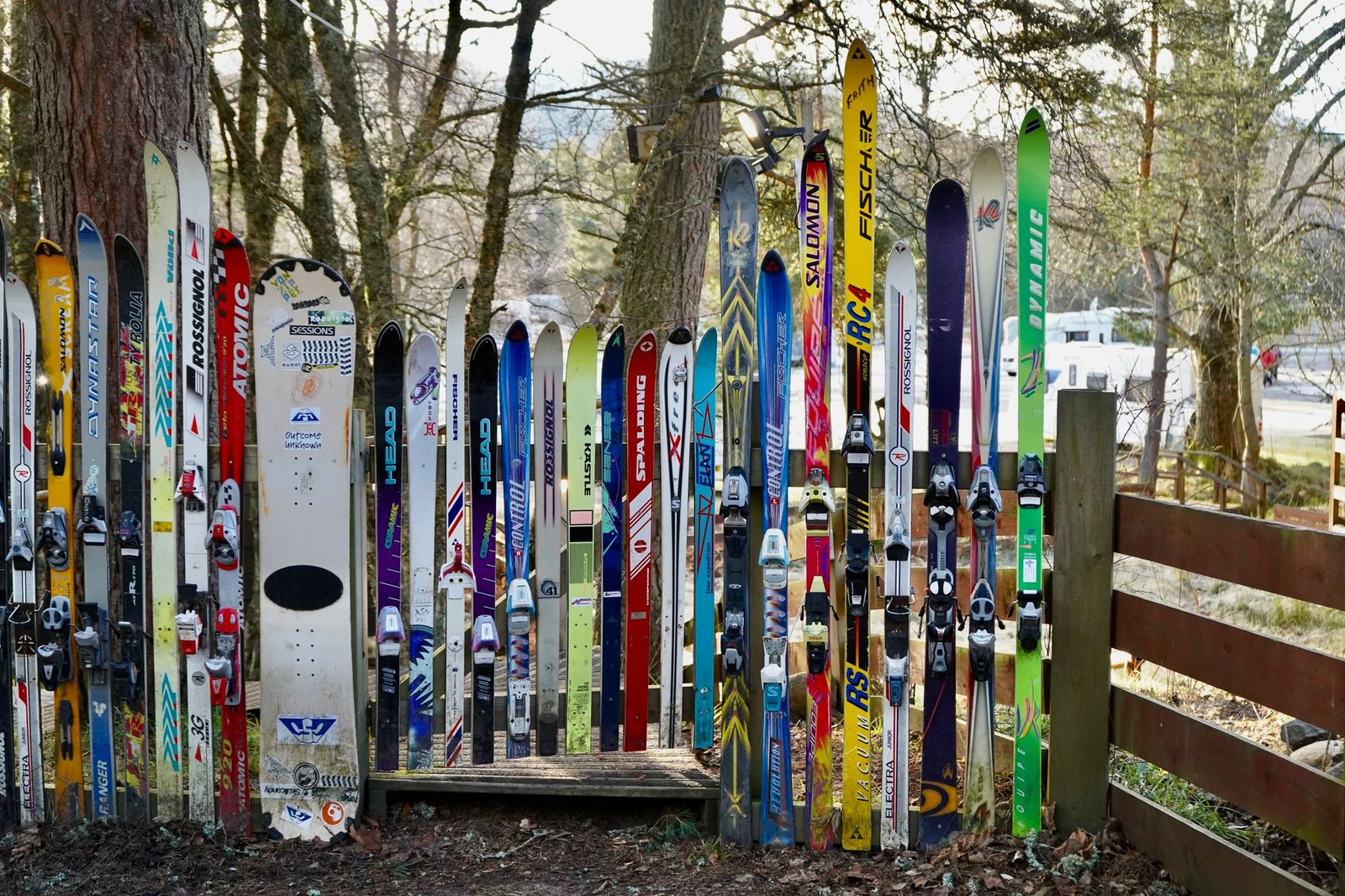 A display of skis and snowboards outdoors in Aviemore Centre, Scotland