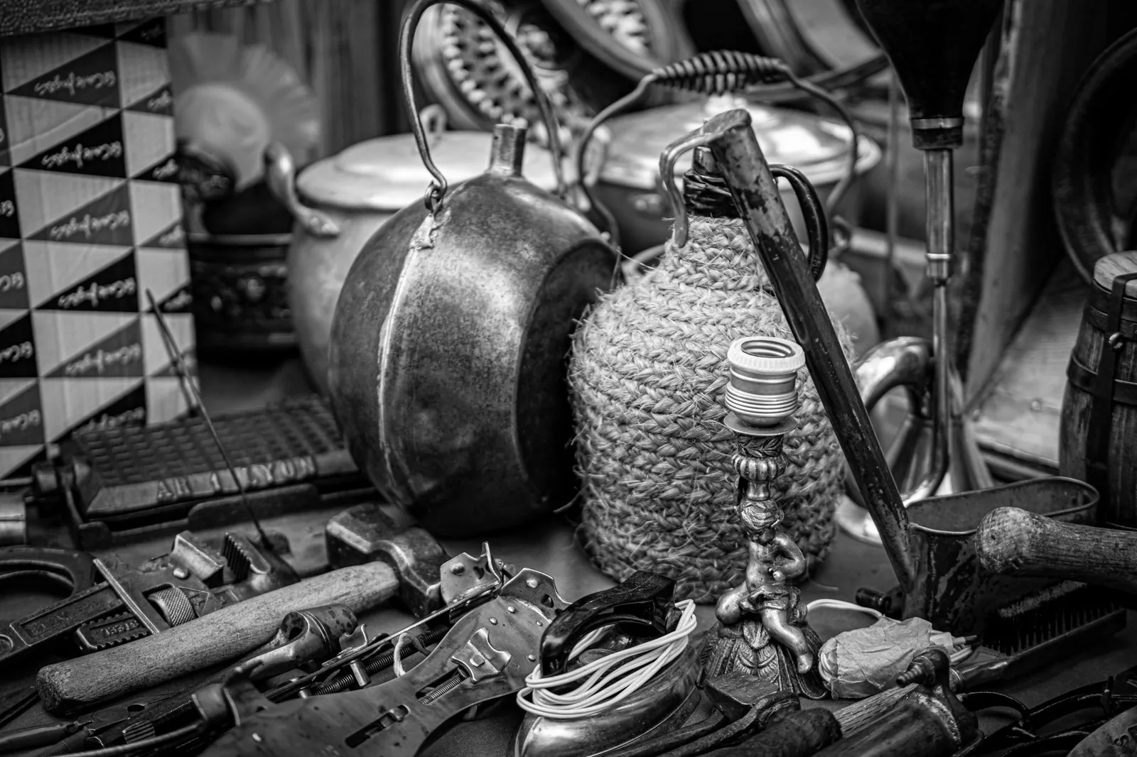 Black and white photo of vintage items at a flea market in Madrid