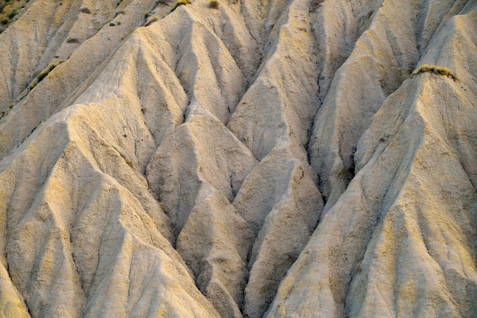High angle aerial shot showcasing unique erosion patterns in rocky terrain