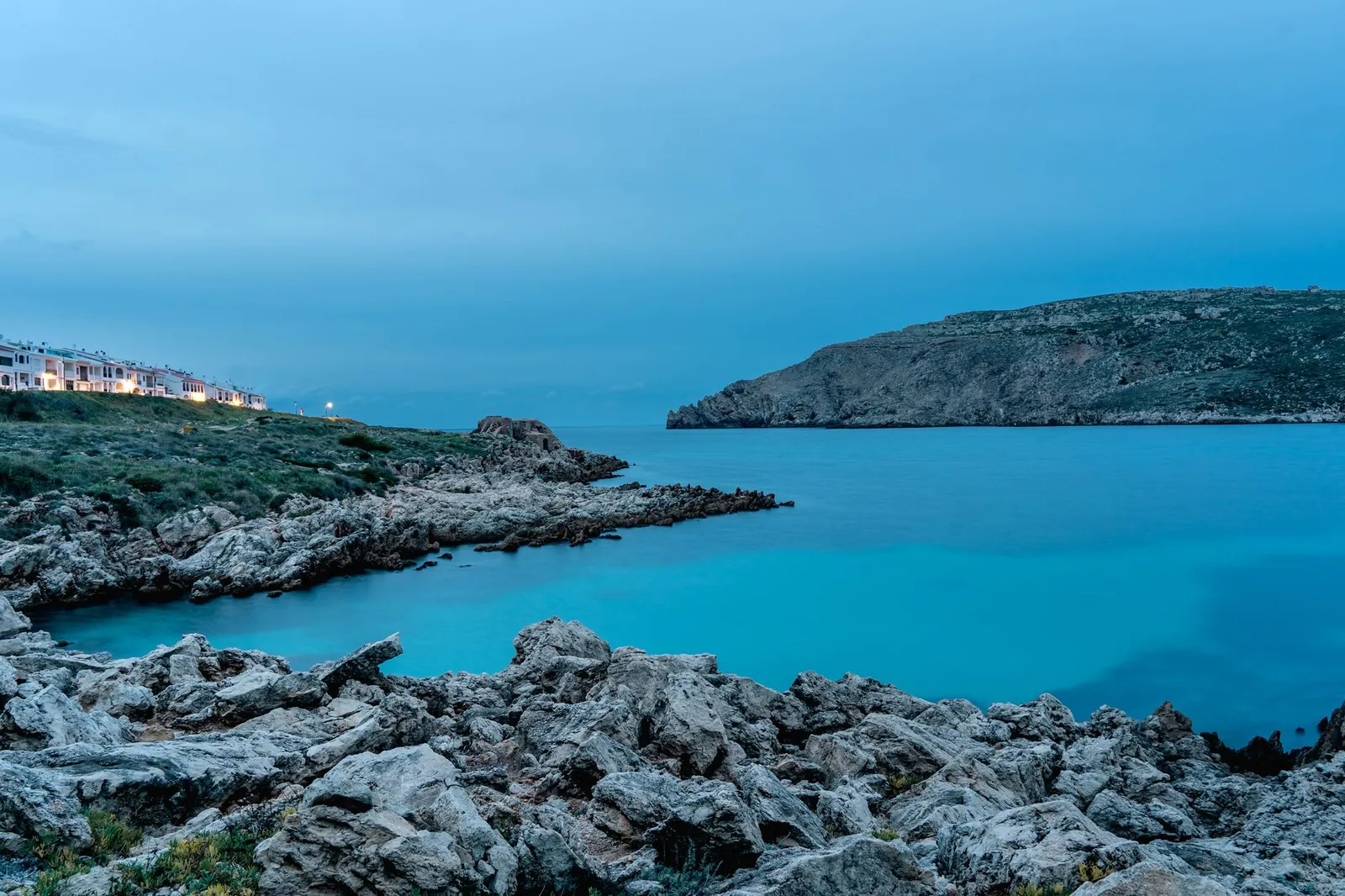 coastal landscape of Ciudadela de Menorca with rocky shores and blue sea