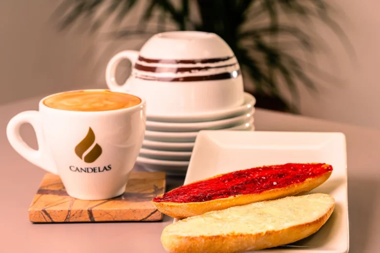 Warm morning breakfast with coffee, toast, and jam in a cozy setting
