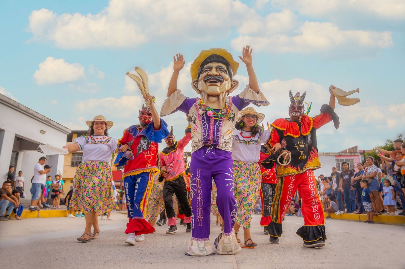 Colorful traditional festival parade in Rioja, Peru, featuring costumes and joyful participants