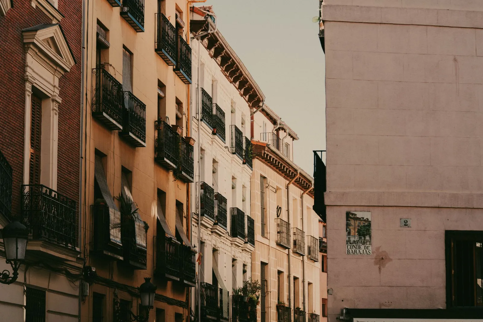 view of historic European street with classic architecture at sunset