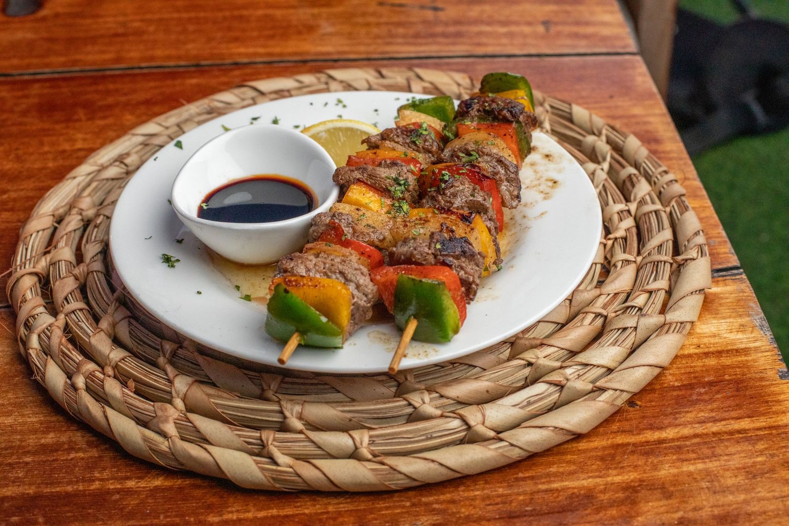 Tasty grilled skewers with mixed veggies and dipping sauce, perfect for a summer BBQ