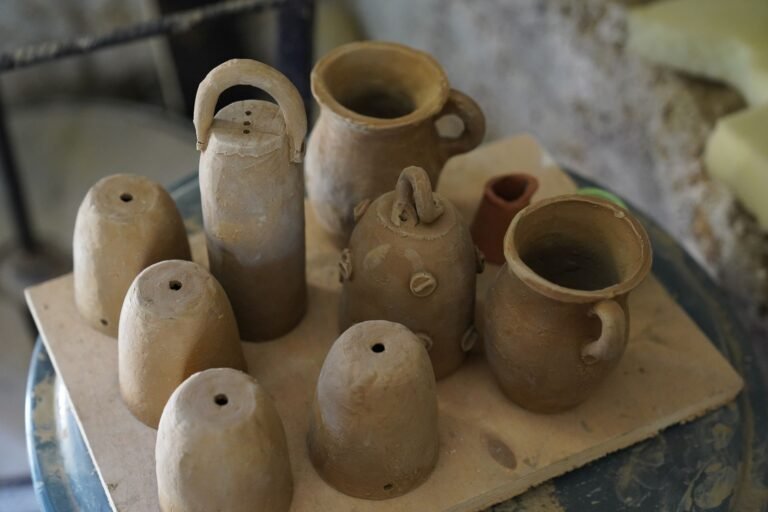 Collection of handcrafted clay pots in a traditional pottery workshop, showcasing artisanal craftsmanship