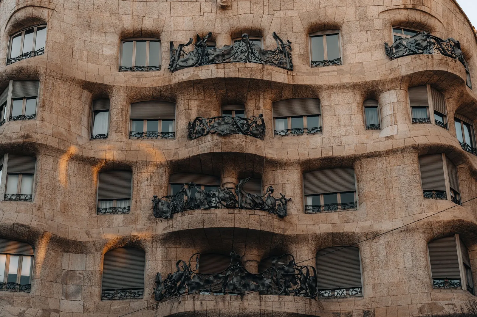 Detailed view of the curving stone balconies of Casa Milà in Barcelona, Spain