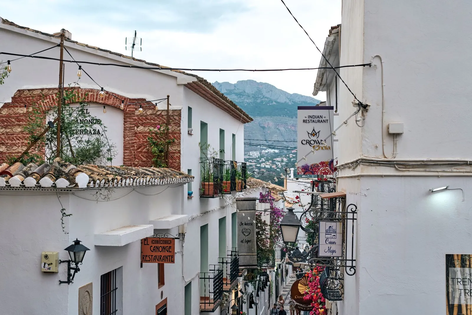 street in Altea featuring traditional architecture and mountain views