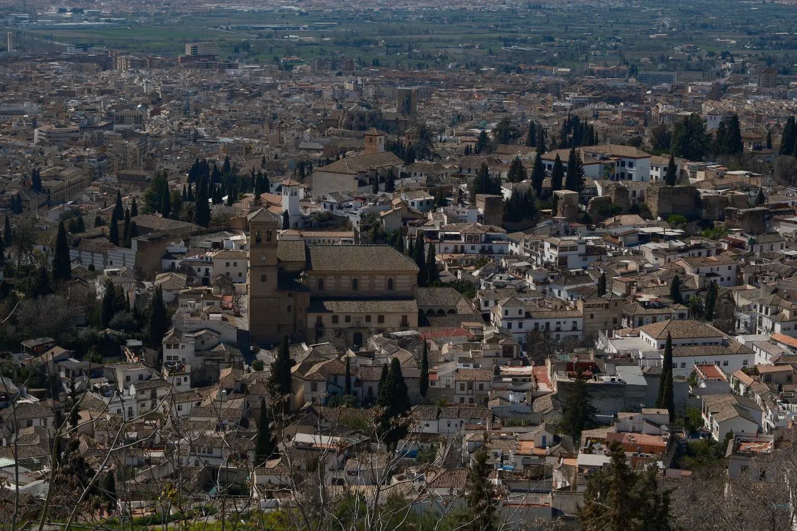 Aerial view of Granada's historic cityscape with iconic Alhambra architecture