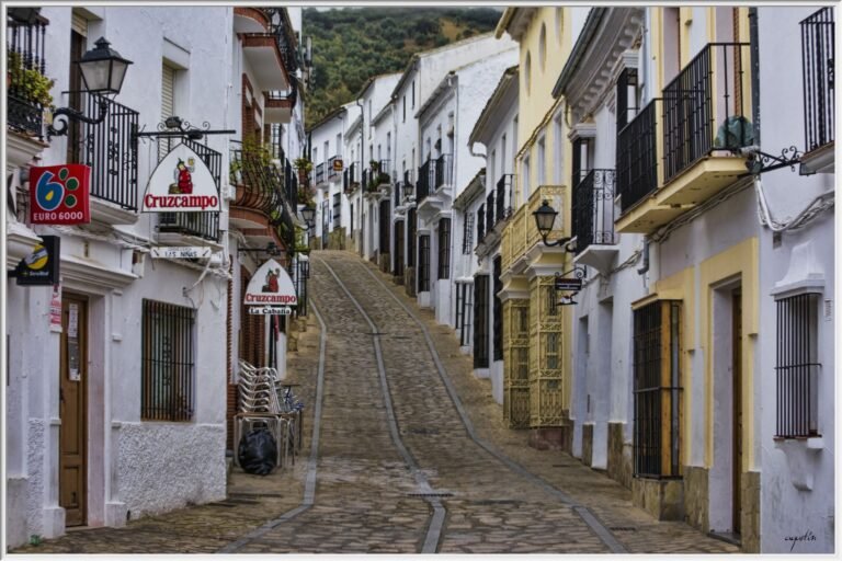 historic street view in Zahara de la Sierra, Andalusia, featuring traditional white buildings