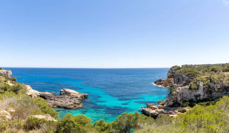 view of Sant Antoni de Portmany's turquoise sea and cliffs