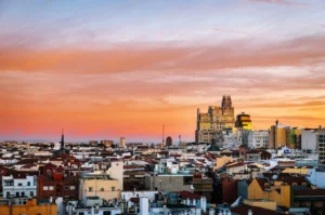 view of Madrid's skyline at sunset showcasing iconic architecture and sky