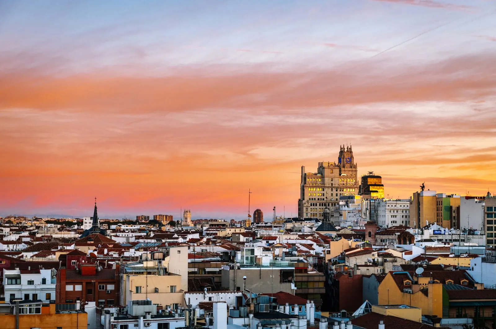 view of Madrid's skyline at sunset showcasing iconic architecture and sky
