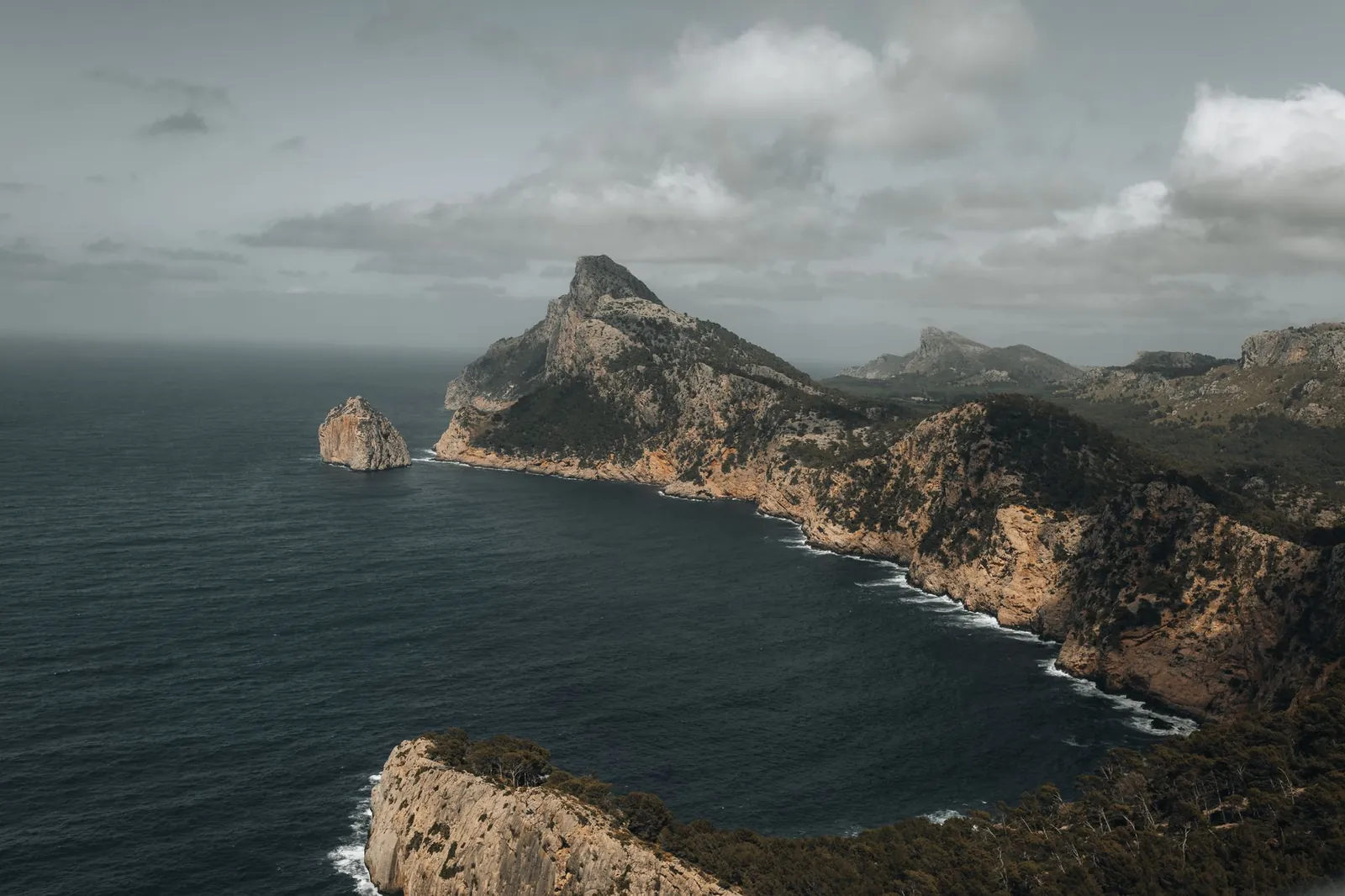 A aerial view of the rugged coastline and cliffs of Cap de Formentor in Mallorca, Spain