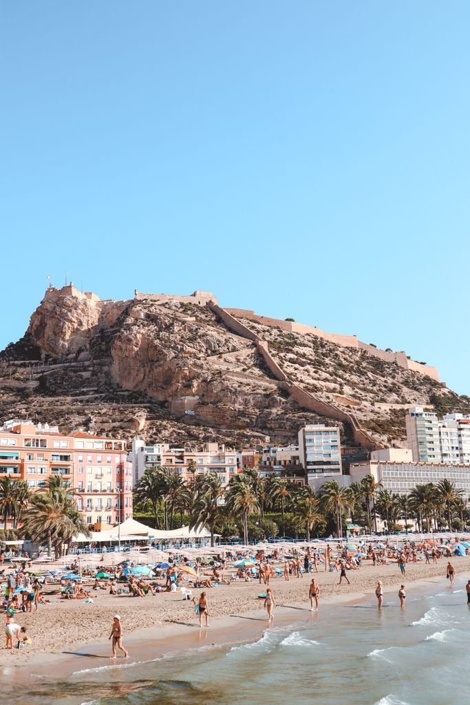 Postiguet beach in Alicante with Santa Barbara Castle in the background